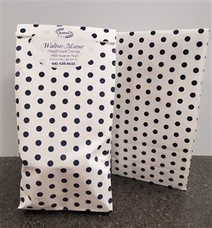 White paper bag with polka dots