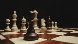 photo of black pawn on chess board